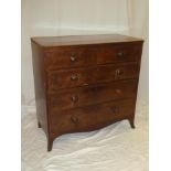 A Victorian mahogany chest of two short and three long drawers with turned handles on bracket feet