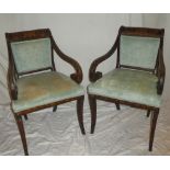 A pair of 19th century Dutch inlaid mahogany carver arm chairs with leaf and floral decoration,