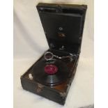 An HMV portable gramophone in fibre case