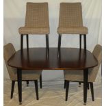 A 1960's G-Plan teak and ebonised dining suite by E.