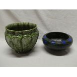 An Ault pottery circular jardiniere with raised leaf decoration on green ground and a Minton's