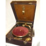 A good quality old RCA Victor portable gramophone with polished mahogany and gilt mounts in red