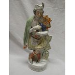 A Victorian Staffordshire pottery figure of a Highland bagpiper,
