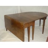 A George III D-end dining table comprising a rectangular drop leaf centre table and a pair of