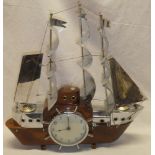 An unusual Art Deco polished wood and chromium-plated mantel clock/lamp in the form of a