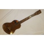 An unusual 1950's/1960's guitar-shaped wall mirror 40" long