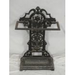 A Victorian cast iron stick stand with floral pierced back and rectangular base,
