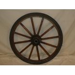 An old wooden spoked wagon/car wheel 31" diameter