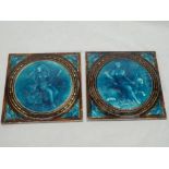 A pair of Minton Hollins & Co square ceramic tiles with figured decoration on turquoise and brown