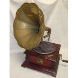 A reproduction gramophone by HMV with brass horn