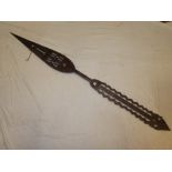 An African carved wood paddle with pierced decoration 59" long