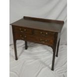 A 19th century oak rectangular side table with two short and one long drawer in the frieze on