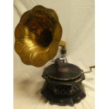 An ebonised octagonal gramophone with brass horn