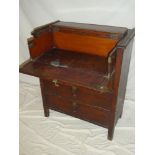 A 19th Century mahogany and pine ship's writing desk with hinged lid and secretaire drawer above