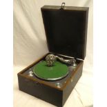 A small portable gramophone with chromium plated mounts in fibre case