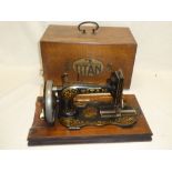 An old Winselmann Titan sewing machine retailed by Greenways of Oxford in walnut case