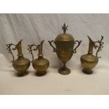 A pair of Indian brass tapered ewers with figure and animal decoration 8½" high;