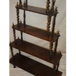 A 19th Century rosewood five tier whatnot with spiral twist supports