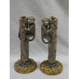 A pair of Portuguese Majolica glazed candlesticks in the form of monkeys climbing tree trunks 10"