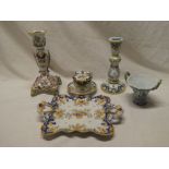 Two French Quimper tapered candlesticks with floral decoration, similar two-handled square plate,