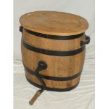 An old metal-bound elm oval butter churning barrel and oval cover 19" high