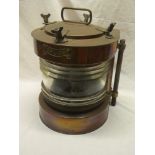 A brass mounted copper semi-circular ship's "toplight" lantern with electric light fitment 13" high