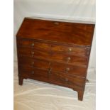 A George III mahogany bureau with pigeon holes,