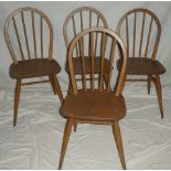 A set of four 1960's Ercol light elm spindle-back dining chairs