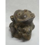An unusual tribal-style terracotta figure with grotesque mask top 6½" high