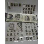An album containing a selection of unusual film star cards including small Clovis chocolate film