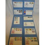 Three albums containing over 140 Jersey and Guernsey First Day covers,