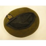 A Second War khaki beret with Intelligence Corps cap badge