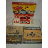 A Mettoy "Computcar", mint in original box and a Chad Valley Naval Tiddlywinks set,