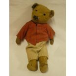 An old straw filled plush covered teddy bear 15" long