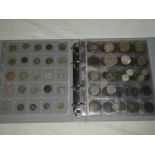 An album containing a selection of mixed Foreign coins including numerous silver examples