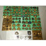 A collection of over 90 various cap badges and insignia - World Navy and Shipping Lines including
