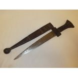 An African dagger with double edged steel blade in tooled leather hilt and scabbard