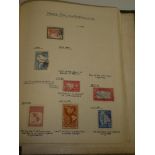 A folder album containing a documented collection of British Commonwealth and World stamps
