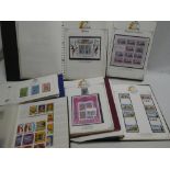 Various albums containing a collection of QEII mint and used stamps including Silver Jubilee,