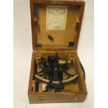 A brass mounted painted metal sextant by Kelvin & Hughes Limited in fitted case