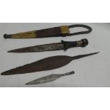 An African dagger with double edged steel blade in leather sheath and two various iron spearheads