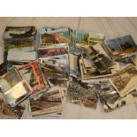 A large selection of various black and white and coloured postcards, topographical views etc.