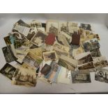 A selection of various black and white and coloured postcards together with Victorian carte de