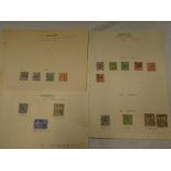 Three album pages containing a collection of Hyderabad stamps including over-prints