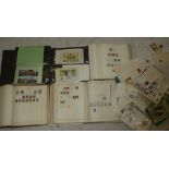 A large box containing various World stamps in albums, postcards, covers etc.