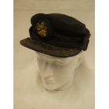 An early British Rail blue peaked cap with gilt badge and braided peak