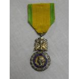 A French Medaille Militaire with ribbon