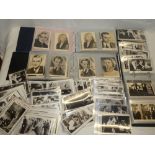 Three albums of weekly film star postcards together with various loose related postcards etc.