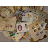 A large box containing numerous packets of World stamps together with album pages of World stamps,