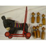 A plush covered straw filled push-along donkey with metal frame and a selection of six wooden